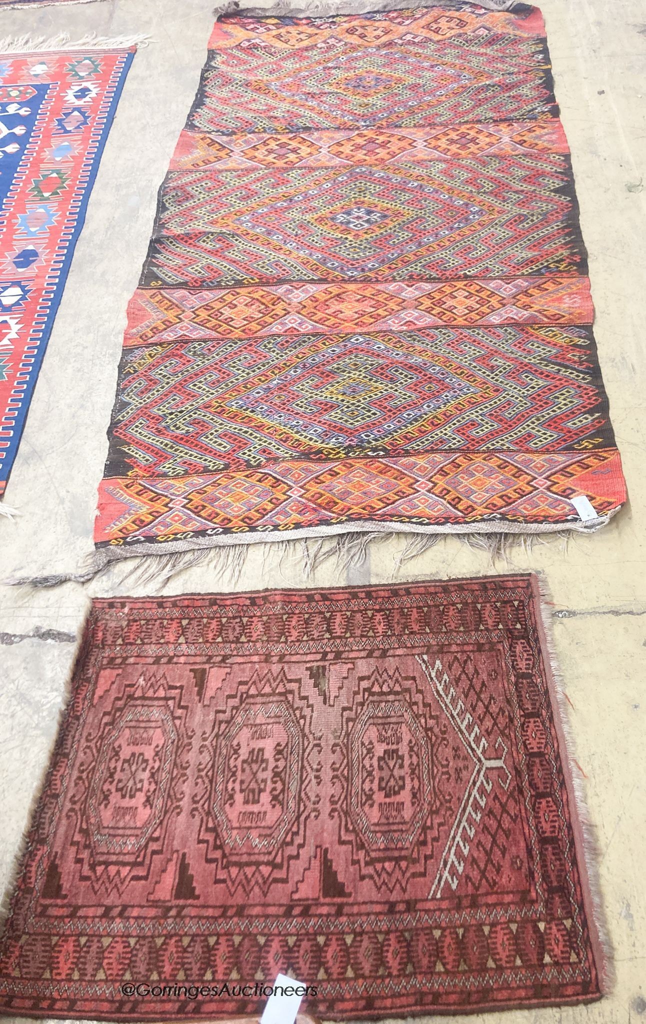 A polychrome flatweave geometric rug, 240 x 124cm together with a smaller Bokhara rug